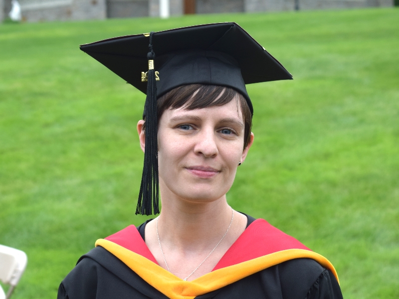 Close up of Amber in their graduation robe